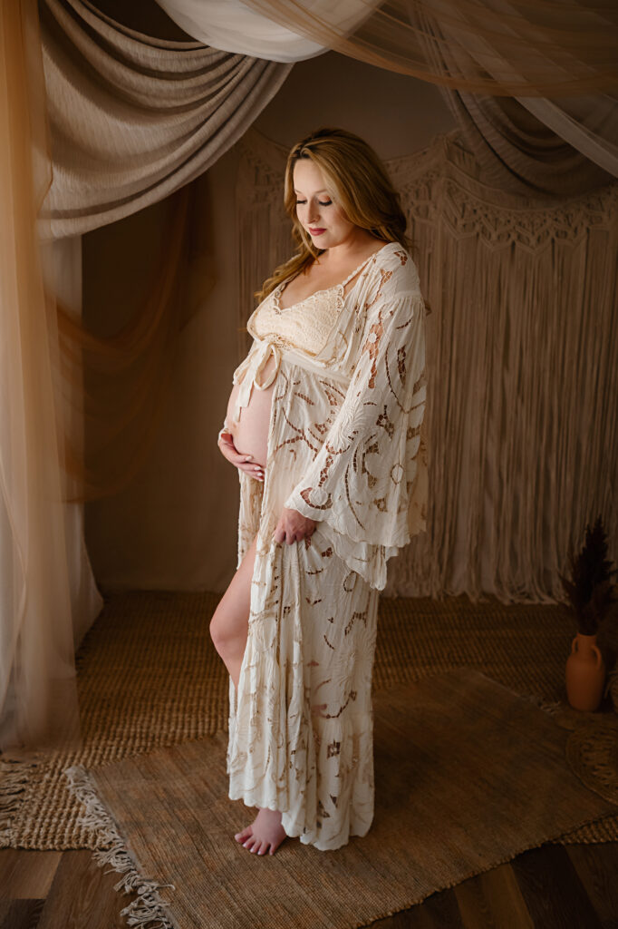 Beautiful bohemian maternity photos of mother-to-be in a flowing dress