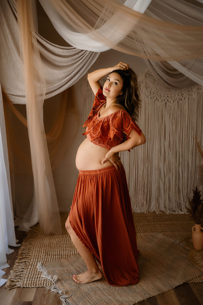 Maternity image of a client in a bohemian style two piece outfit, by Fort Worth Photographer Paula Goforth 