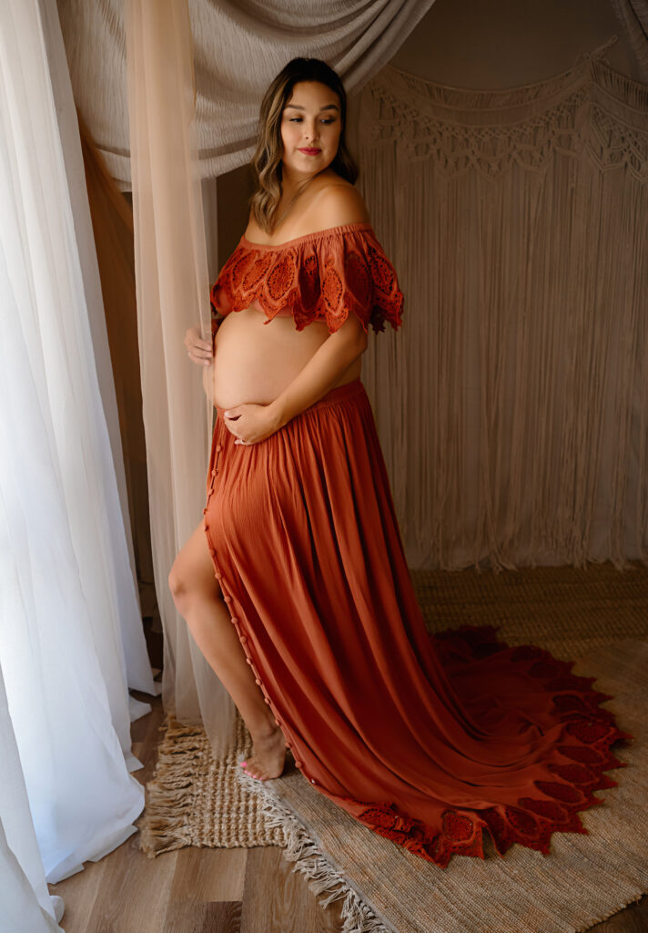 Maternity image of a client in a bohemian style two piece outfit, by Fort Worth Photographer Paula Goforth 