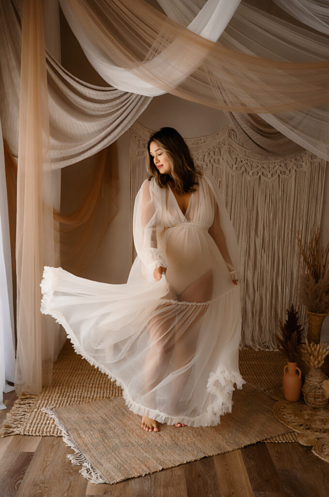 Maternity image of a client in a flowing dress, by Fort Worth Photographer Paula Goforth 