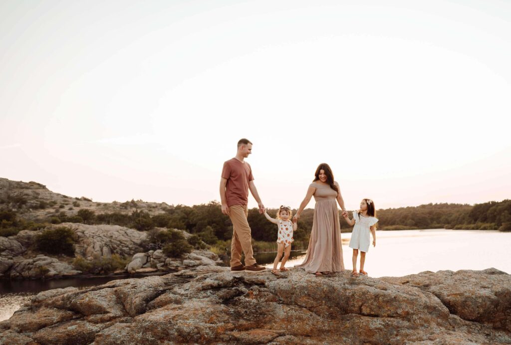 beautiful family holding hands on the rocks in North Texas 