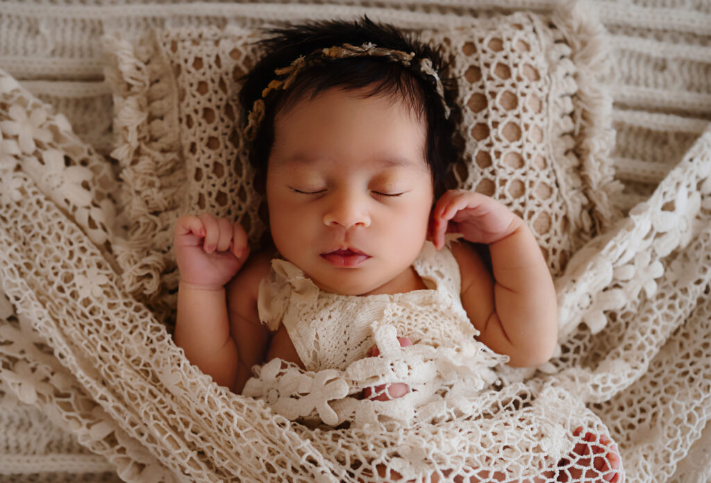 Image of newborn baby wrapped in lace by Fort Worth photographer Paula Goforth 