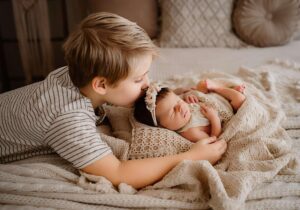 Studio newborn sessions with siblings