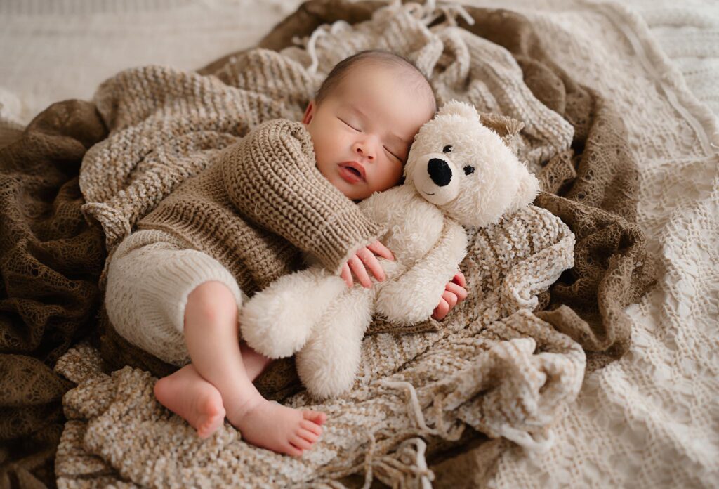 Newborn image of baby wrapped in a swaddle by newborn photographer Paula Goforth in Fort Worth Texas