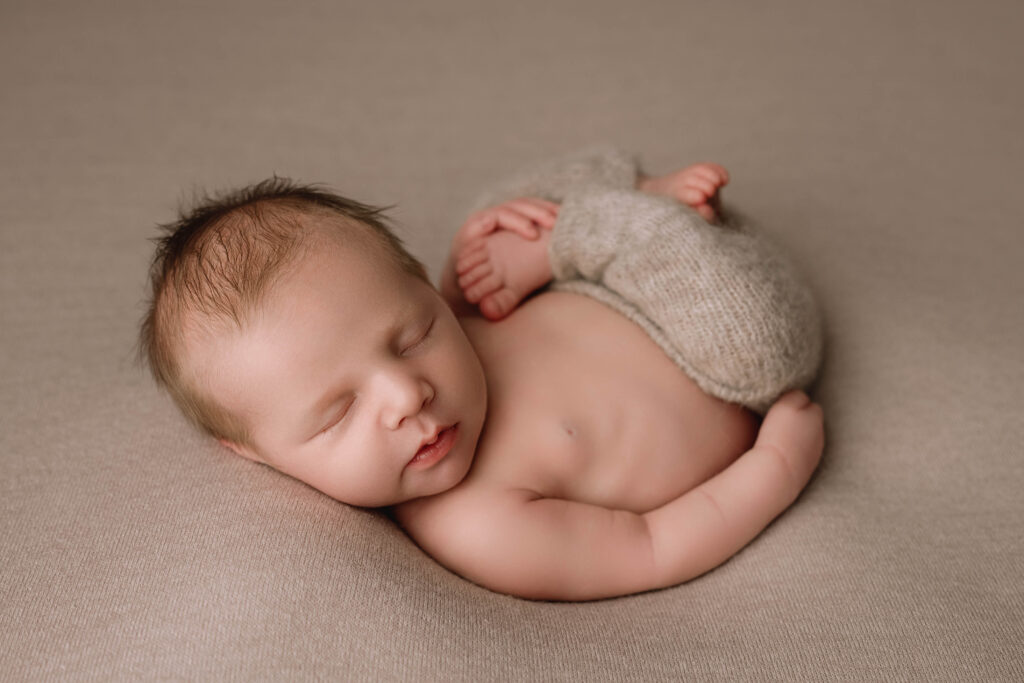 Beautiful newborn photo of swaddled baby by Fort Worth newborn photographer Paula Goforth 