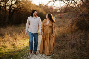 Mother in dress in golden hour maternity session in Fort Worth Texas