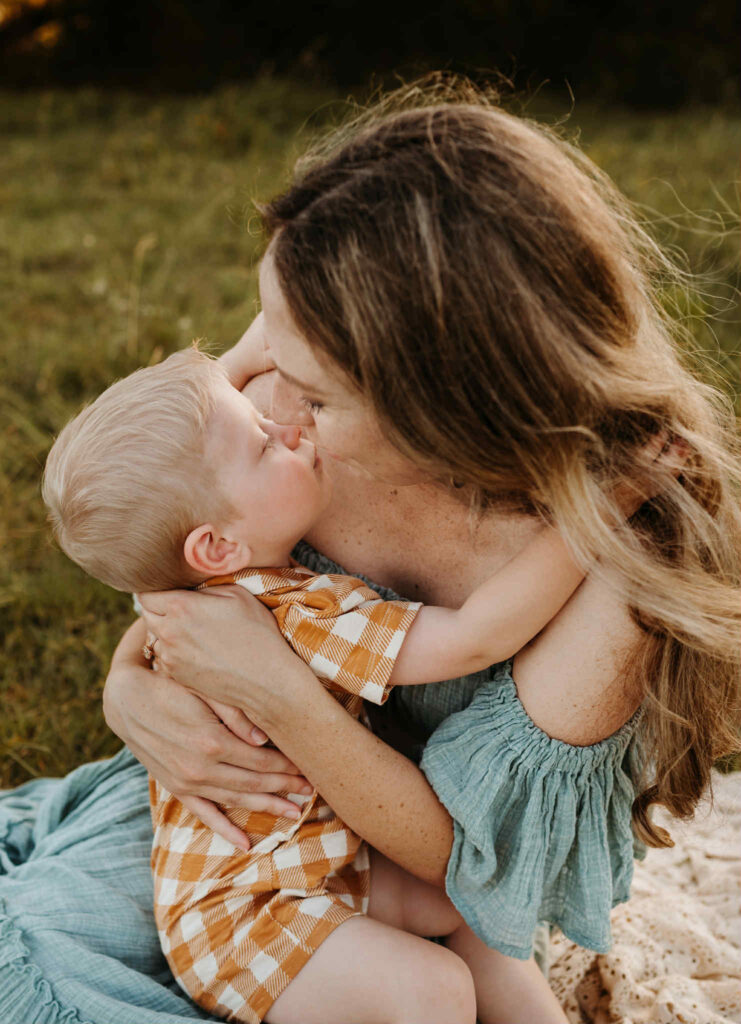 Family in sunlit Texas field during a self-care inspired photo session