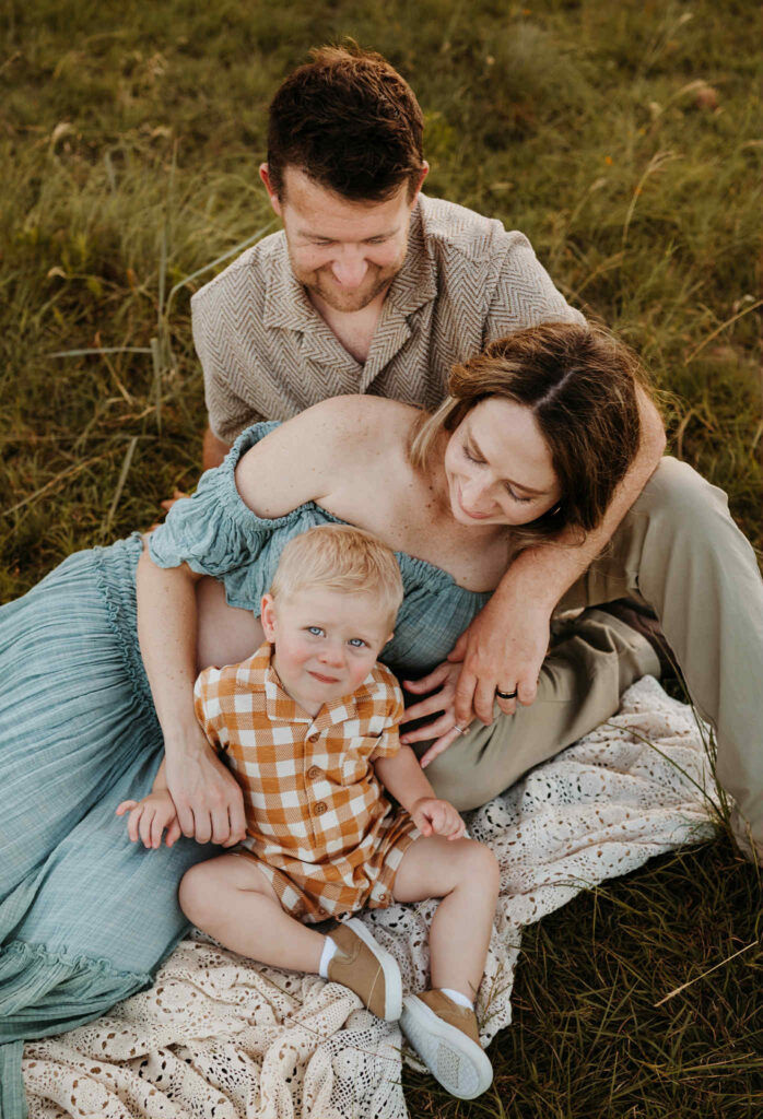 Family in sunlit Texas field during a self-care inspired photo session