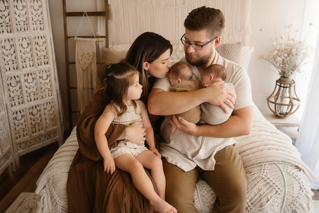 Newborn twin brothers peacefully sleeping side by side in a Fort Worth photography studio